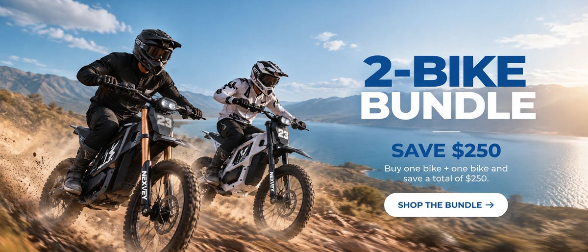 NEXVEY 2-Bike Bundle: two riders on black and white electric dirt bikes beside a mountain lake. Buy two bikes and save a total of $250.