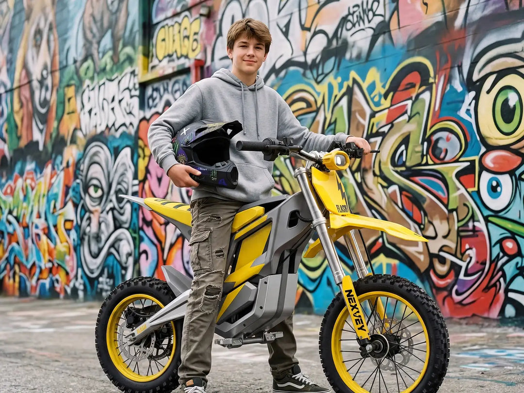 Detail shot of the yellow NEXVEY Flash electric dirt bike featuring a full protective body shell to ensure rider safety and component durability