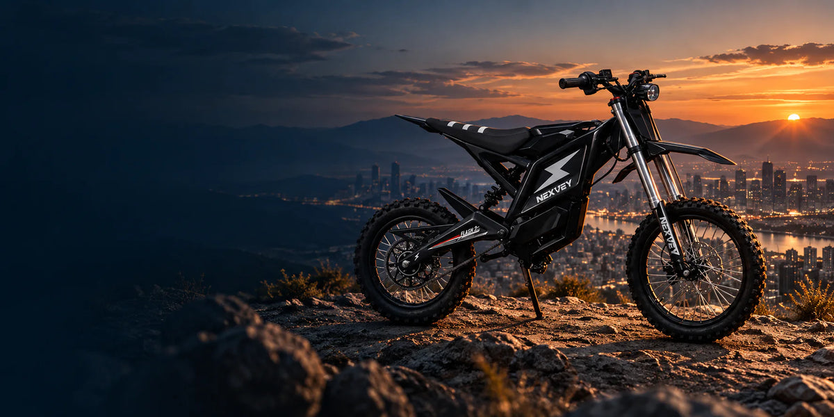 NEXVEY FLASH 2 electric bike overlooking a city and mountains at sunset