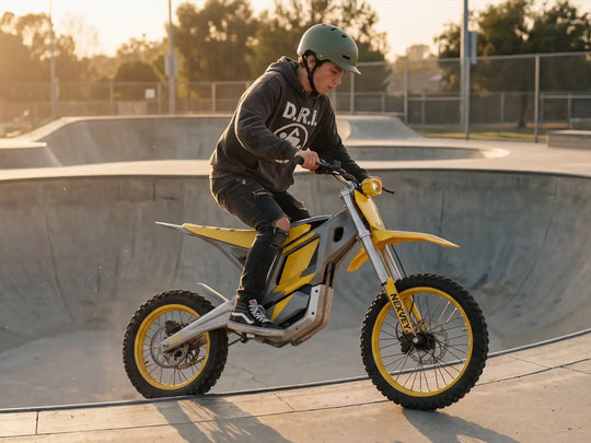 A teenage rider in a hoodie and helmet navigating the edge of a concrete bowl on a yellow NEXVEY FLASH electric dirt bike at a skatepark during sunset