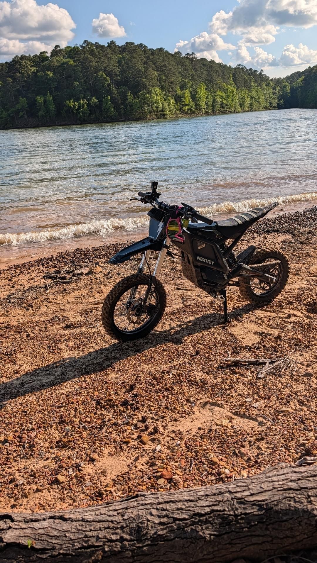 Black NEXVEY Flash electric dirt bike on a beach trail