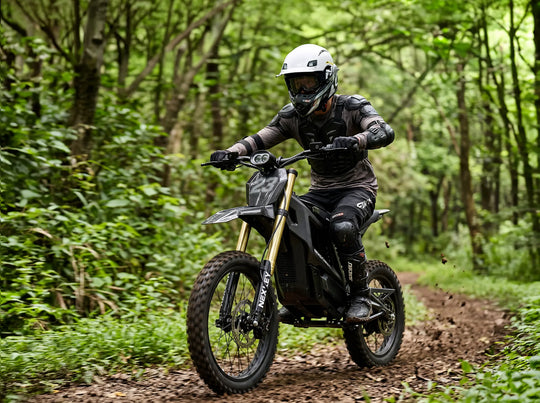 A teenage rider on the Nexvey Flash Pro electric dirt bike navigating a rugged forest trail, showcasing powerful off-road capabilities