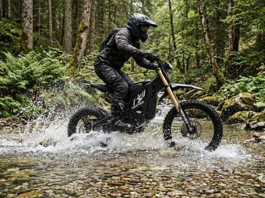 A rider splashing through a shallow creek on the Nexvey Flash Pro electric dirt bike, demonstrating its excellent water resistance and all-terrain capabilities for youth.