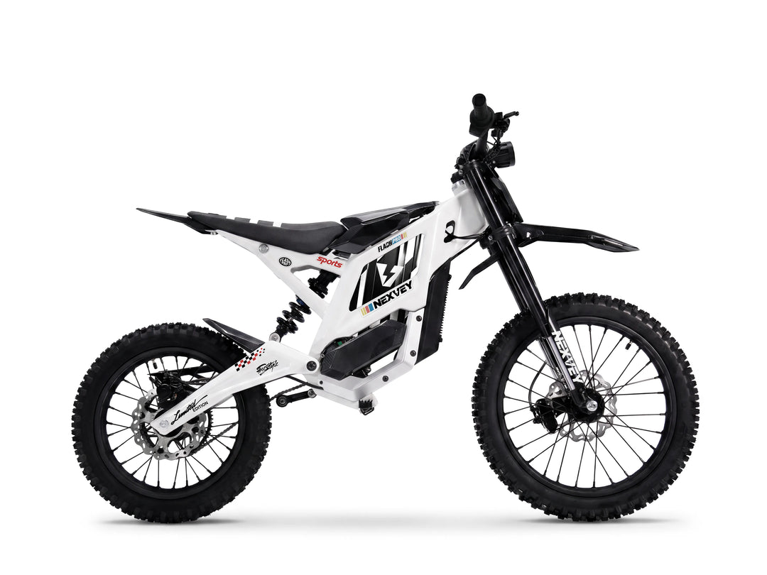 White NEXVEY Flash Pro youth electric motorcycle with off-road tires and full suspension isolated on white background.