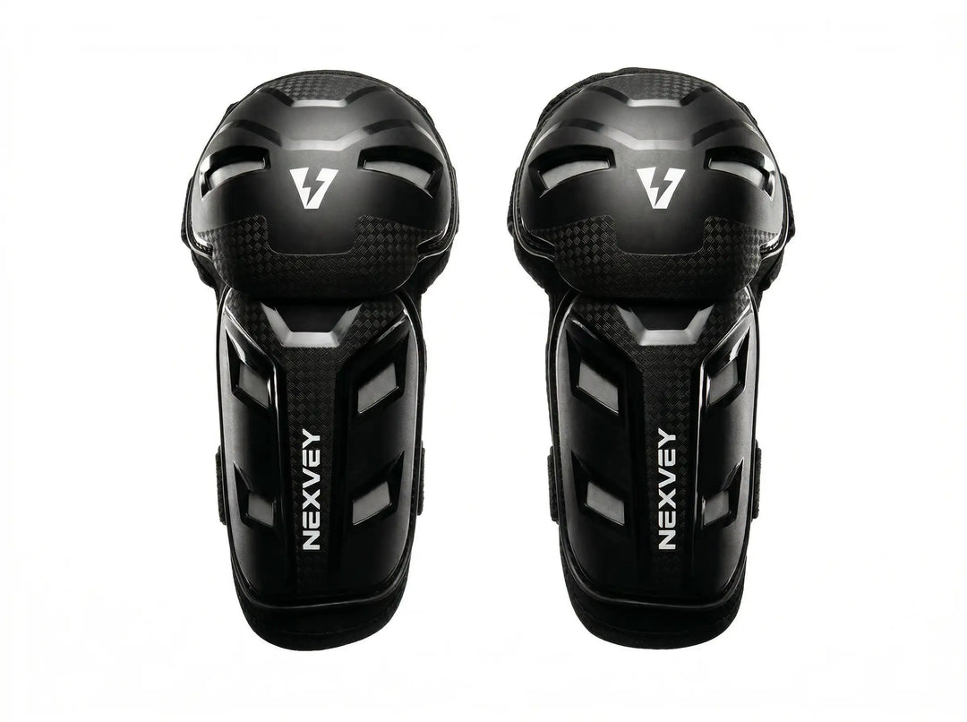 Nexvey black youth motocross knee guards and shin pads for kids dirt bike riding, featuring impact-resistant outer shell and carbon fiber texture design