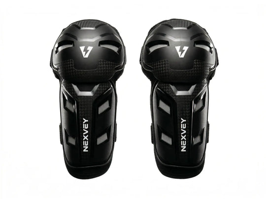 Nexvey black youth motocross knee guards and shin pads for kids dirt bike riding, featuring impact-resistant outer shell and carbon fiber texture design
