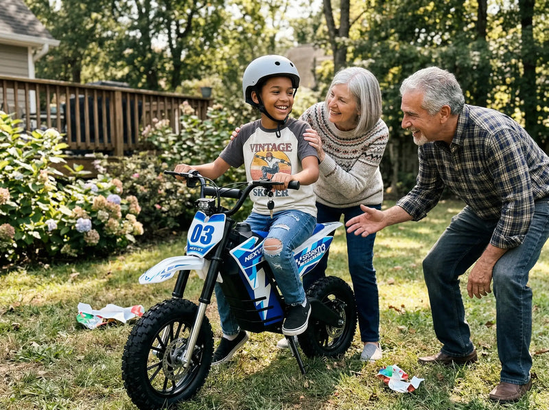 A young boy smiling on his new NEXVEY Spark 03 electric dirt bike gift, joined by his happy grandparents in a backyard setting, ideal for beginner youth riders