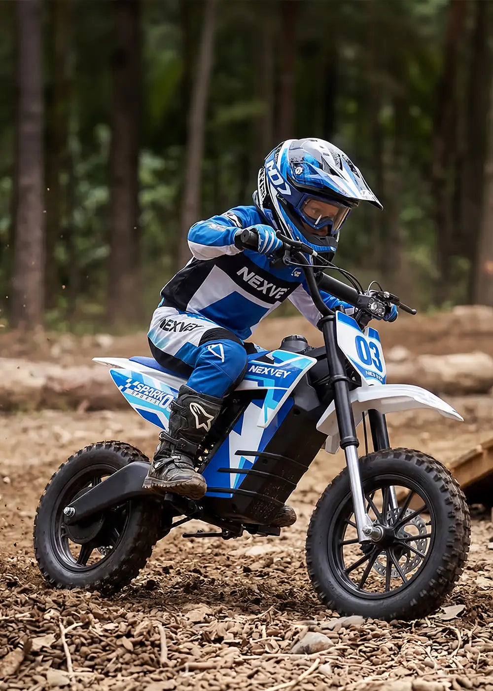 Young rider in professional NEXVEY racing gear operating a Spark 03 electric dirt bike through a forest off-road trail