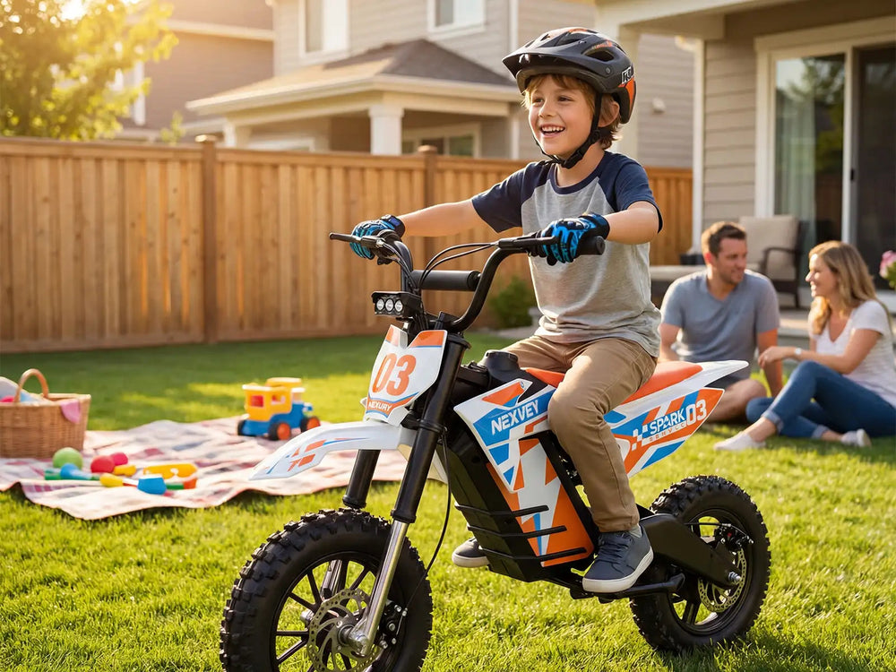 appy boy riding an orange Nexvey Spark 03 electric dirt bike in the backyard with parents watching in the background